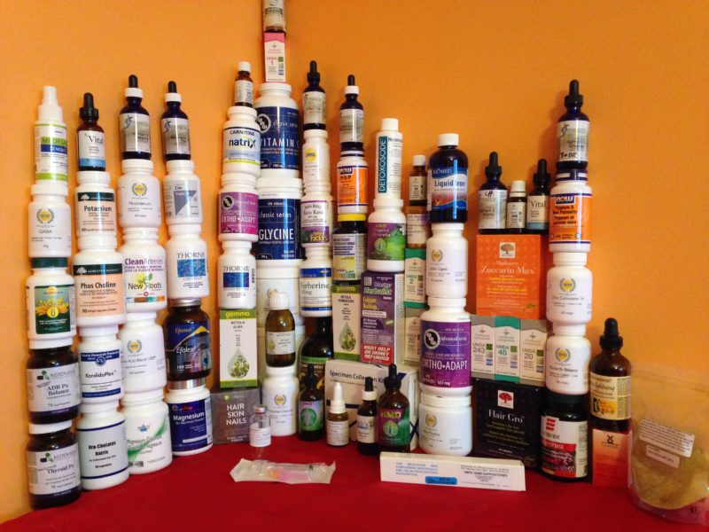 a corner of a room filled with medicine pill bottles