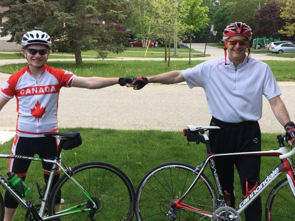 wayne biking with a friend first bumping